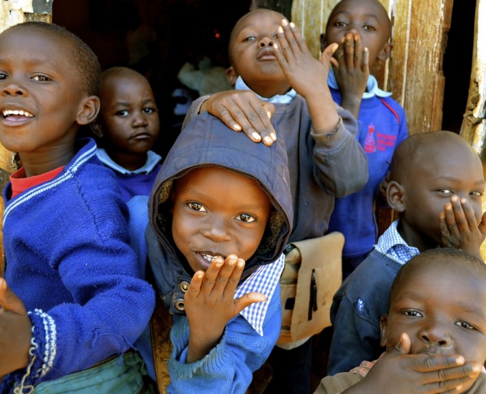 Children blowing kisses.